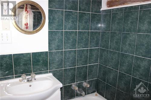 The bathroom is modern with pretty blue tile. - 4220 Hwy 511 Highway, Lanark, ON - Indoor Photo Showing Bathroom