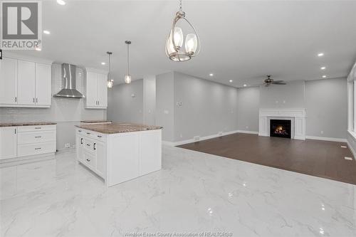 59 Belleview, Kingsville, ON - Indoor Photo Showing Kitchen With Fireplace