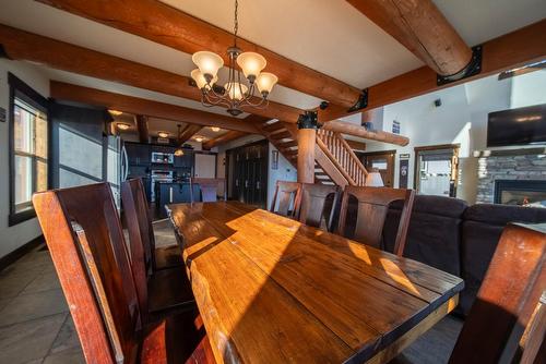 1676 Koocanusa Lake Drive, Newgate, BC - Indoor Photo Showing Dining Room With Fireplace