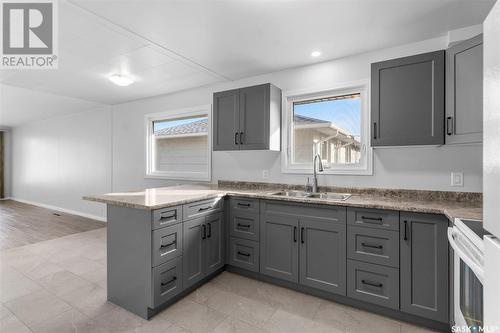 211 3Rd Avenue W, Watrous, SK - Indoor Photo Showing Kitchen With Double Sink