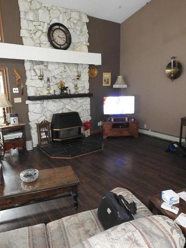 3745 Highway 97A, Armstrong, BC - Indoor Photo Showing Other Room With Fireplace