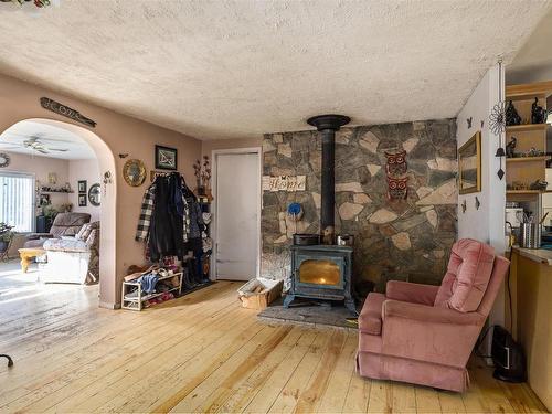 85 Ernest Avenue, Beaverdell, BC - Indoor Photo Showing Other Room With Fireplace