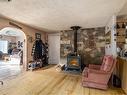 85 Ernest Avenue, Beaverdell, BC  - Indoor Photo Showing Other Room With Fireplace 