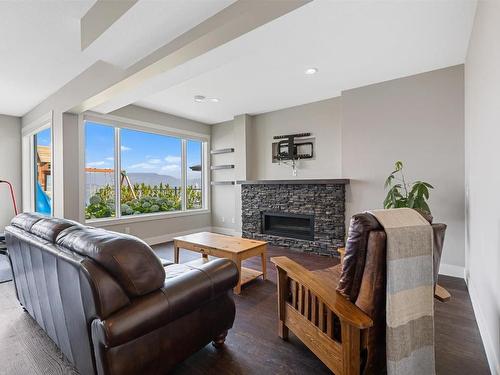 5590 Trestle Ridge Court, Kelowna, BC - Indoor Photo Showing Living Room With Fireplace