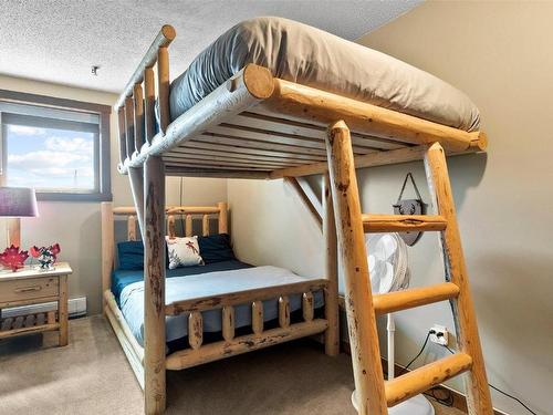 504-7470 Porcupine Road, Big White, BC - Indoor Photo Showing Bedroom