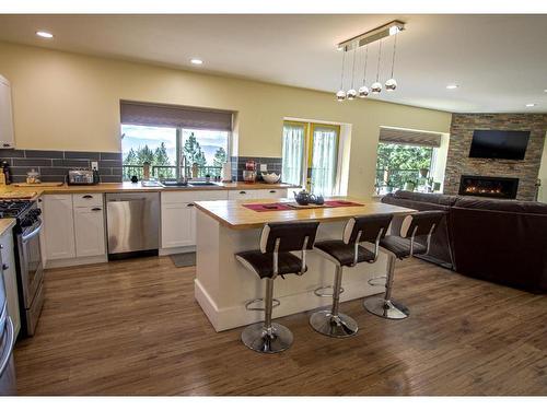 295 Mule Deer Drive, Osoyoos, BC - Indoor Photo Showing Kitchen With Fireplace With Double Sink
