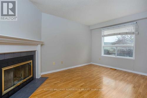 #Upper -58 Bonnycastle Dr, Clarington, ON - Indoor Photo Showing Living Room With Fireplace