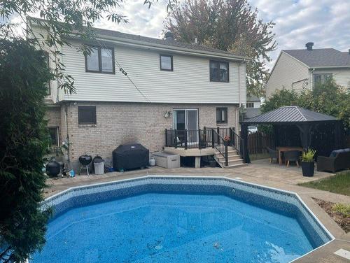 Backyard - 20 Rue Patrick-Mcgee, La Prairie, QC - Outdoor With In Ground Pool