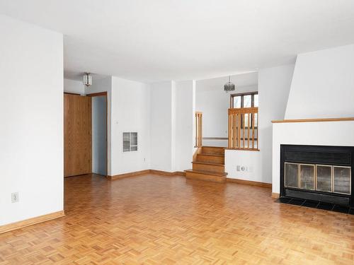 Salle familiale - 1920 Av. Brookdale, Dorval, QC - Indoor With Fireplace