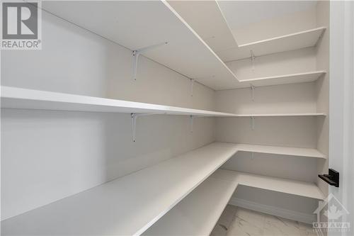 signature walk in pantry a timesaver for kitchen - 404 Barrett Farm Drive, Ottawa, ON - Indoor With Storage