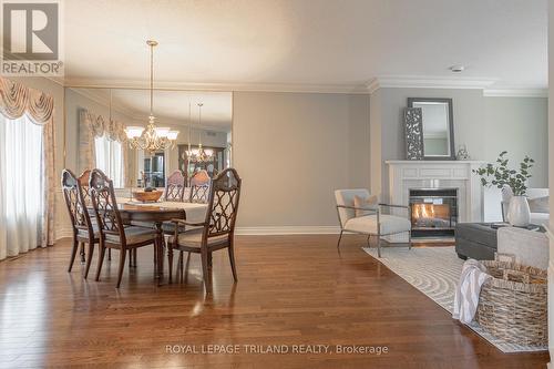 #44 -40 Quinella Dr, London, ON - Indoor Photo Showing Dining Room With Fireplace