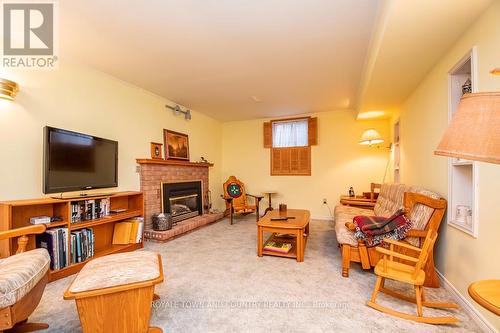 18 Corneil St, Kawartha Lakes, ON - Indoor Photo Showing Living Room With Fireplace