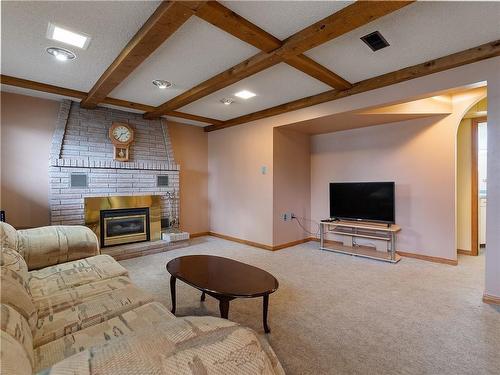 Family Room With Gas Fireplace - 27 Mcgregor Place, Caledonia, ON - Indoor With Fireplace
