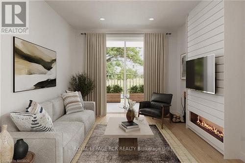 11 - 440 Wellington St Ll E, Wellington North (Mount Forest), ON - Indoor Photo Showing Living Room With Fireplace