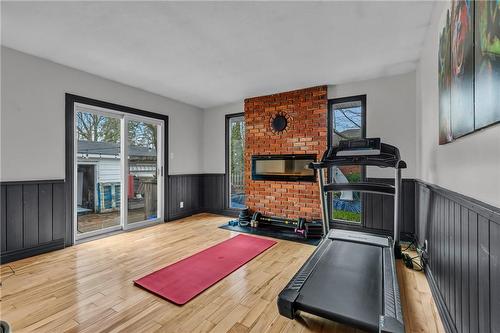 65 Banff Street, Caledonia, ON - Indoor Photo Showing Gym Room With Fireplace