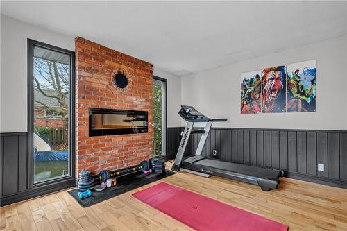 65 Banff Street, Caledonia, ON - Indoor Photo Showing Gym Room With Fireplace
