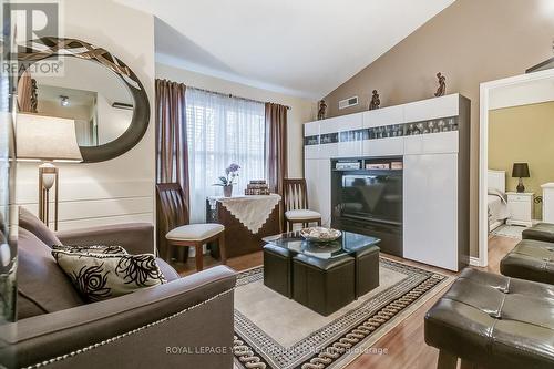 #233 -65 Bristol Rd E, Mississauga, ON - Indoor Photo Showing Living Room With Fireplace
