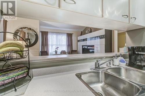 #233 -65 Bristol Rd E, Mississauga, ON - Indoor Photo Showing Kitchen With Double Sink