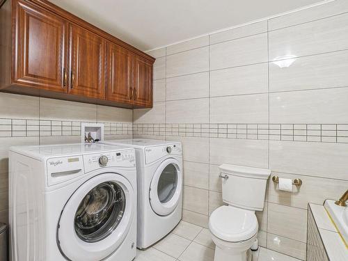 Bathroom - 9 Rue Cedarwood-Court, Kirkland, QC - Indoor Photo Showing Laundry Room