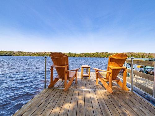 Waterfront - 308 Ch. Du Prospecteur, Amherst, QC - Outdoor With Body Of Water With Deck Patio Veranda