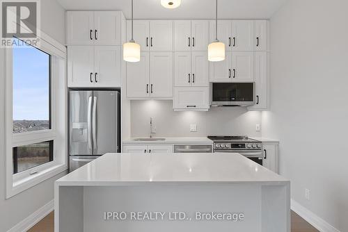 #502 -3285 Carding Mill Tr, Oakville, ON - Indoor Photo Showing Kitchen With Upgraded Kitchen