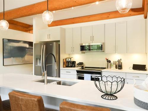 4-9995 Mcculloch Road, Kelowna, BC - Indoor Photo Showing Kitchen With Stainless Steel Kitchen With Double Sink With Upgraded Kitchen