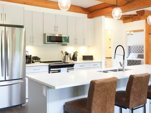 4-9995 Mcculloch Road, Kelowna, BC - Indoor Photo Showing Kitchen With Stainless Steel Kitchen With Double Sink With Upgraded Kitchen