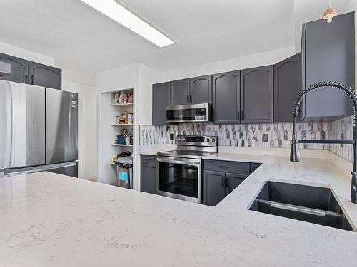 214-3160 Casorso Road, Kelowna, BC - Indoor Photo Showing Kitchen With Stainless Steel Kitchen With Double Sink
