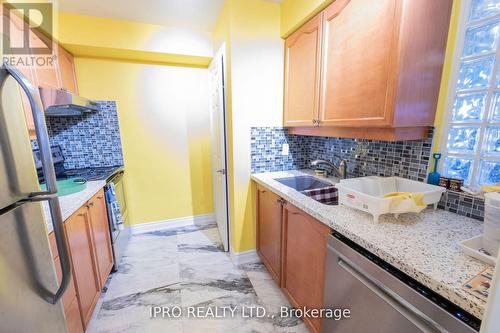 409 - 3880 Duke Of York Boulevard, Mississauga, ON - Indoor Photo Showing Kitchen With Double Sink
