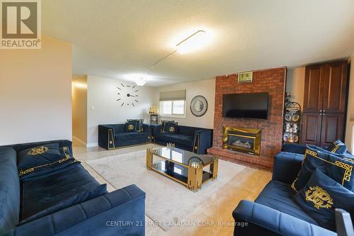 34 Ponderosa Cres, London, ON - Indoor Photo Showing Living Room With Fireplace