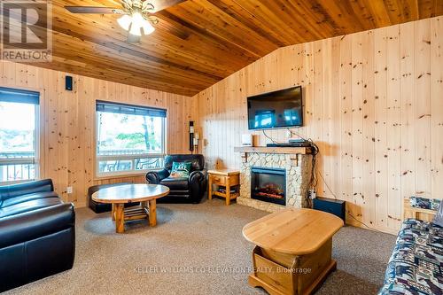 180 Farlain Lake Rd E, Tiny, ON - Indoor Photo Showing Living Room With Fireplace