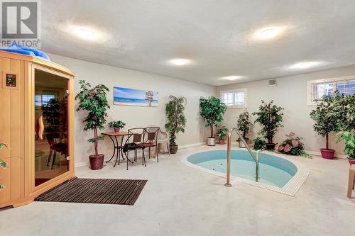 1915 Pacific Court Unit# 504, Kelowna, BC - Indoor Photo Showing Other Room With In Ground Pool