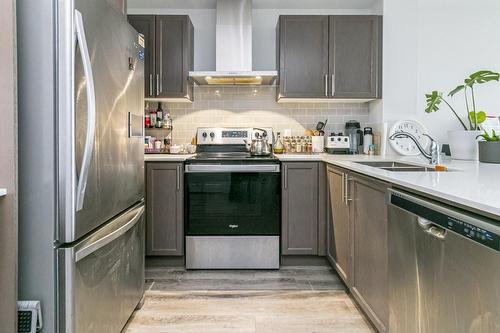 1 Redfern Avenue|Unit #335, Hamilton, ON - Indoor Photo Showing Kitchen With Stainless Steel Kitchen With Double Sink