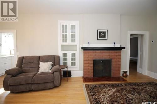 671 2Nd Street E, Shaunavon, SK - Indoor Photo Showing Living Room With Fireplace