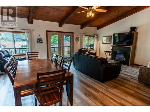 8323 Trans Canada Highway, Revelstoke, BC - Indoor Photo Showing Dining Room With Fireplace