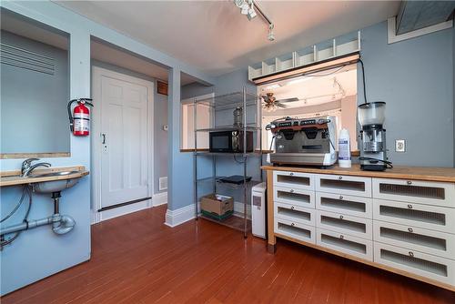 Kitchen with pass through to the living room area - 212 Homewood Avenue, Hamilton, ON 