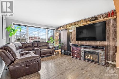 1548 Landry Street, Clarence Creek, ON - Indoor Photo Showing Living Room With Fireplace