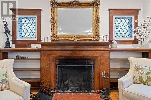7 Thairs Ave, St. Catharines, ON - Indoor Photo Showing Living Room With Fireplace