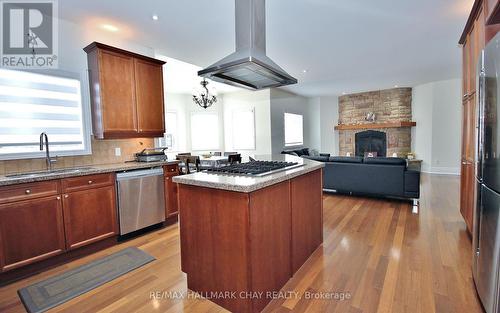 39 Vanderpost Cres, Essa, ON - Indoor Photo Showing Kitchen With Fireplace With Double Sink