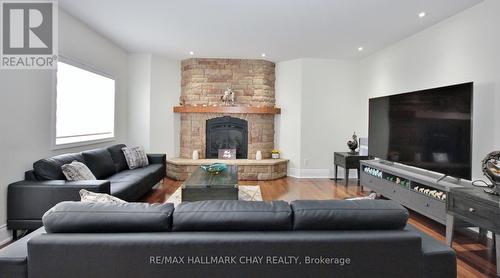 39 Vanderpost Cres, Essa, ON - Indoor Photo Showing Living Room With Fireplace