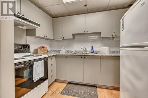 #310 -155 Main St N, Newmarket, ON - Indoor Photo Showing Kitchen With Double Sink