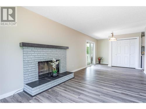 683 San Michelle Road, Kelowna, BC - Indoor Photo Showing Living Room With Fireplace