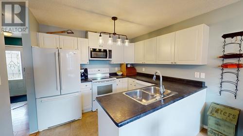 8728 81A Street, Fort St. John, BC - Indoor Photo Showing Kitchen With Double Sink