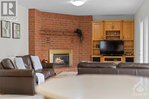 6249 Flewellyn Road, Ottawa, ON - Indoor Photo Showing Living Room With Fireplace