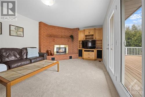 6249 Flewellyn Road, Ottawa, ON - Indoor Photo Showing Living Room With Fireplace
