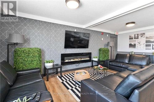 #304 -440 Central Ave, London, ON - Indoor Photo Showing Living Room With Fireplace