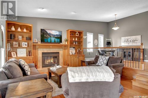 2727 Silverman Bay, Regina, SK - Indoor Photo Showing Living Room With Fireplace
