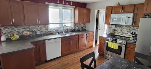 235 3Rd Avenue, Rapid City, MB - Indoor Photo Showing Kitchen With Double Sink