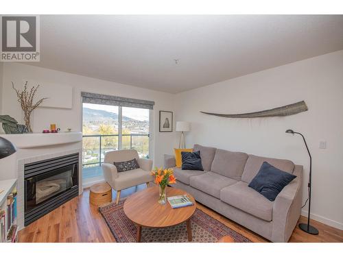 3221 Centennial Drive Unit# 307, Vernon, BC - Indoor Photo Showing Living Room With Fireplace