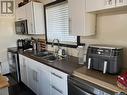 619 1St Street E, Meadow Lake, SK  - Indoor Photo Showing Kitchen With Double Sink 